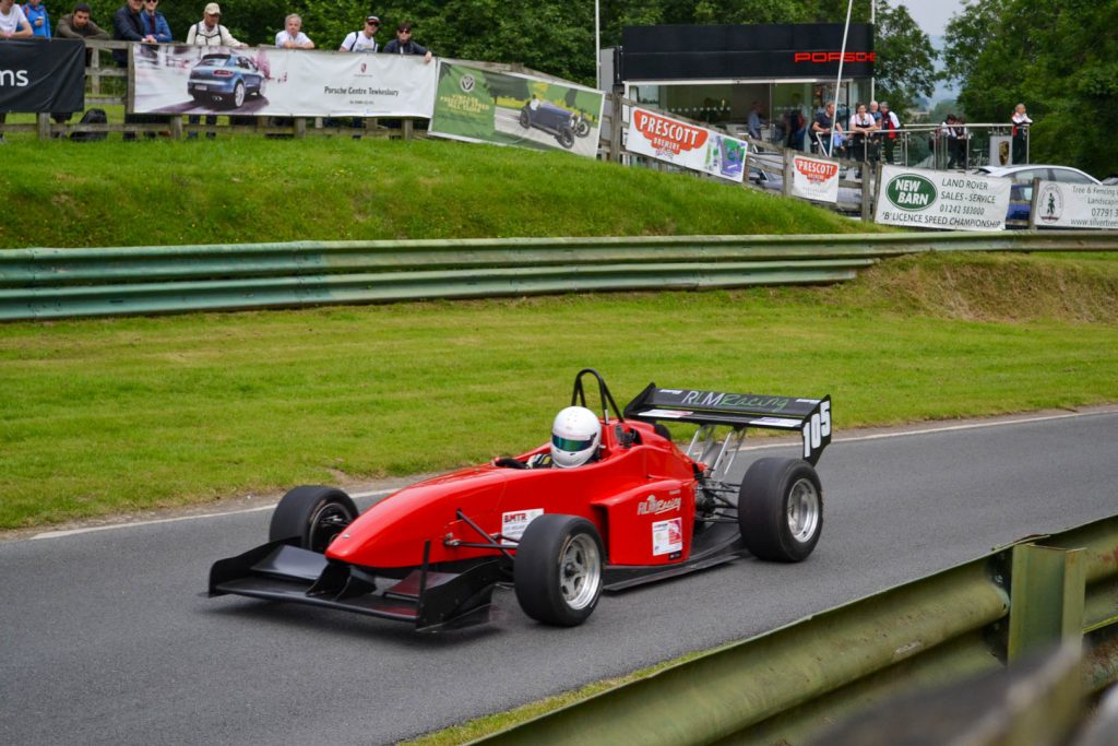 OMS racing car fly by